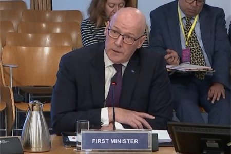 Swinney on the spot: A solemn FM brings his serious face to MSP grilling